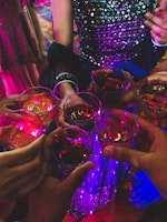 A group of people clinking glasses during a festive event.