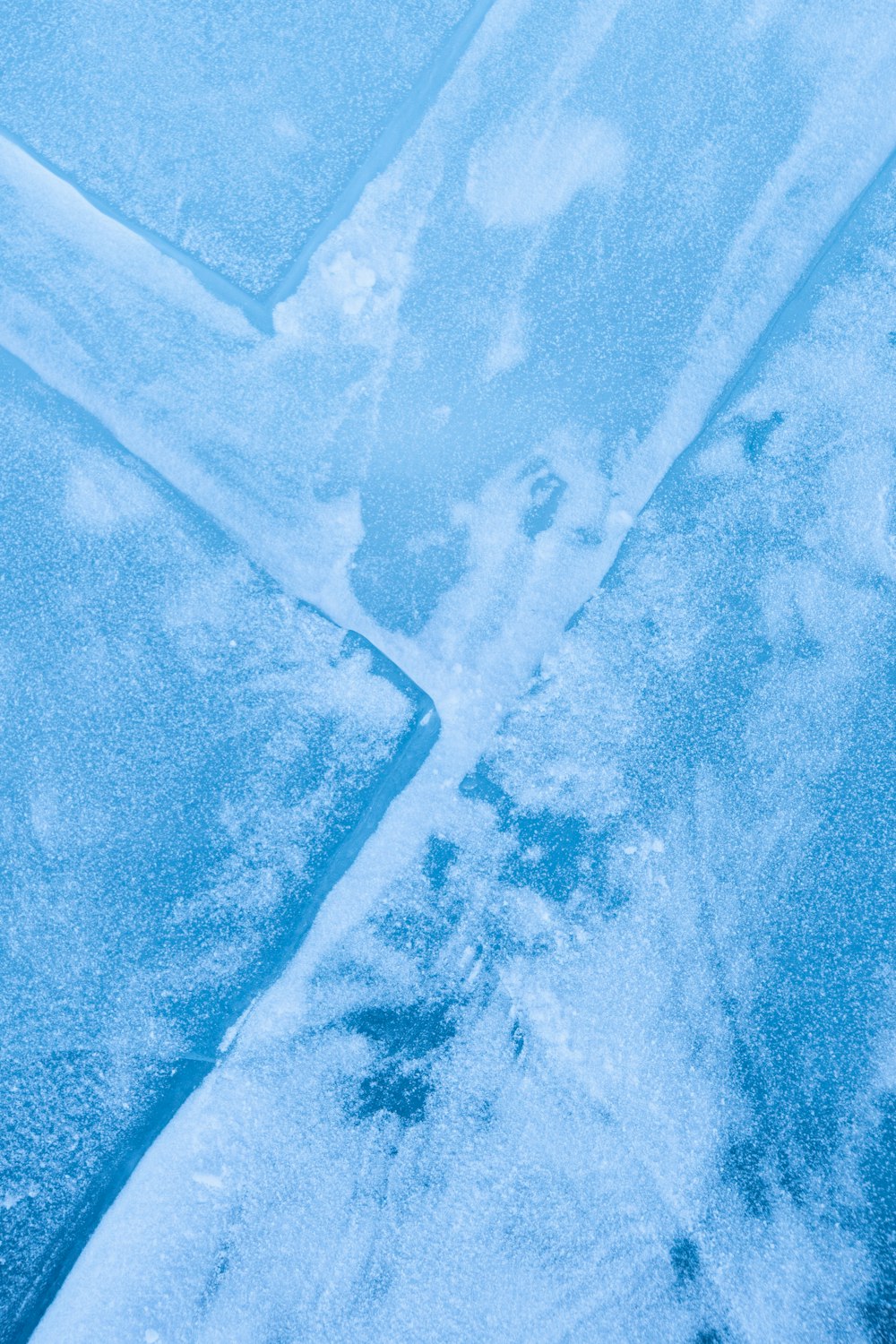 an airplane is flying over a patch of ice