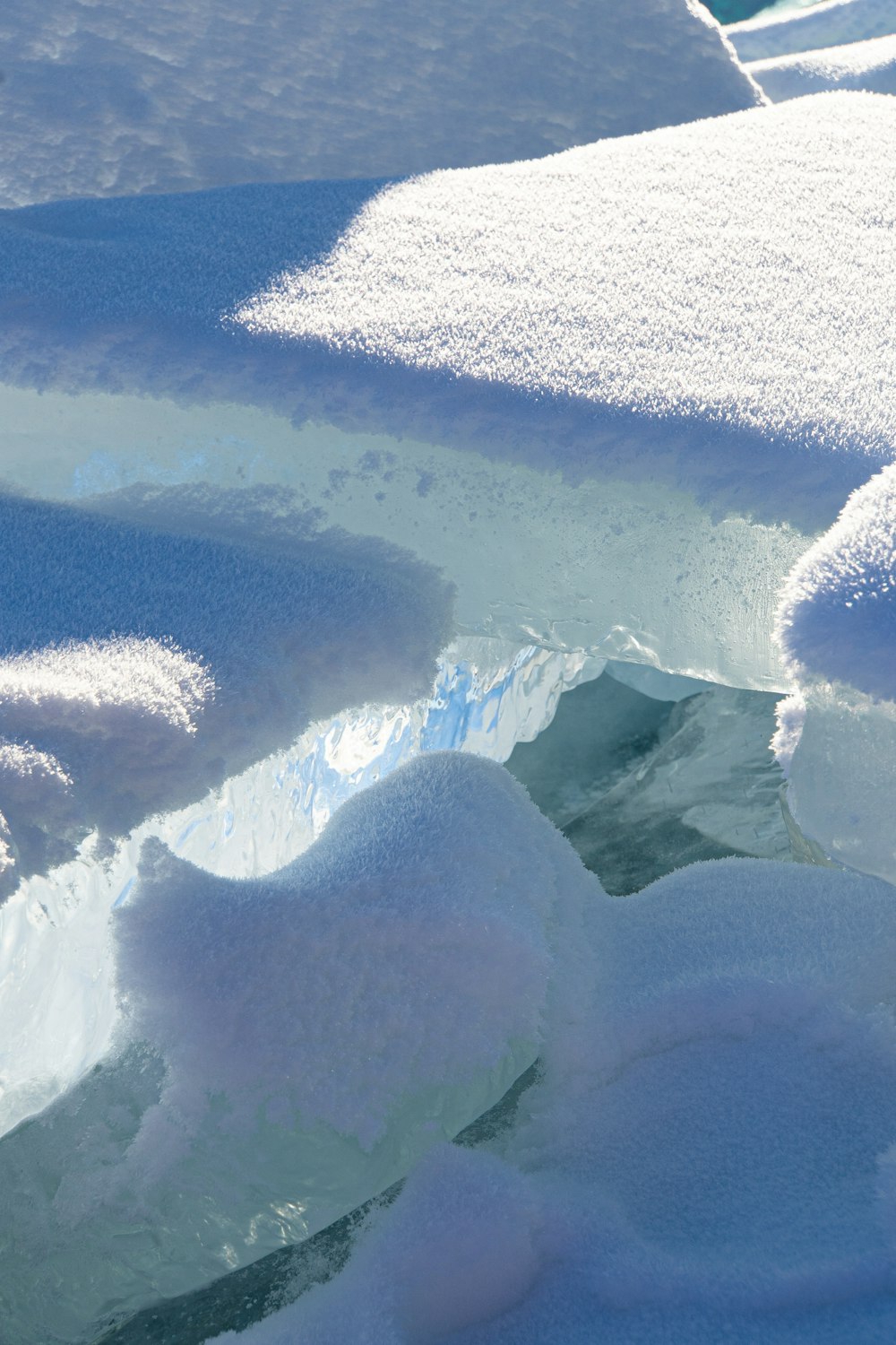 a snow covered area with ice and water