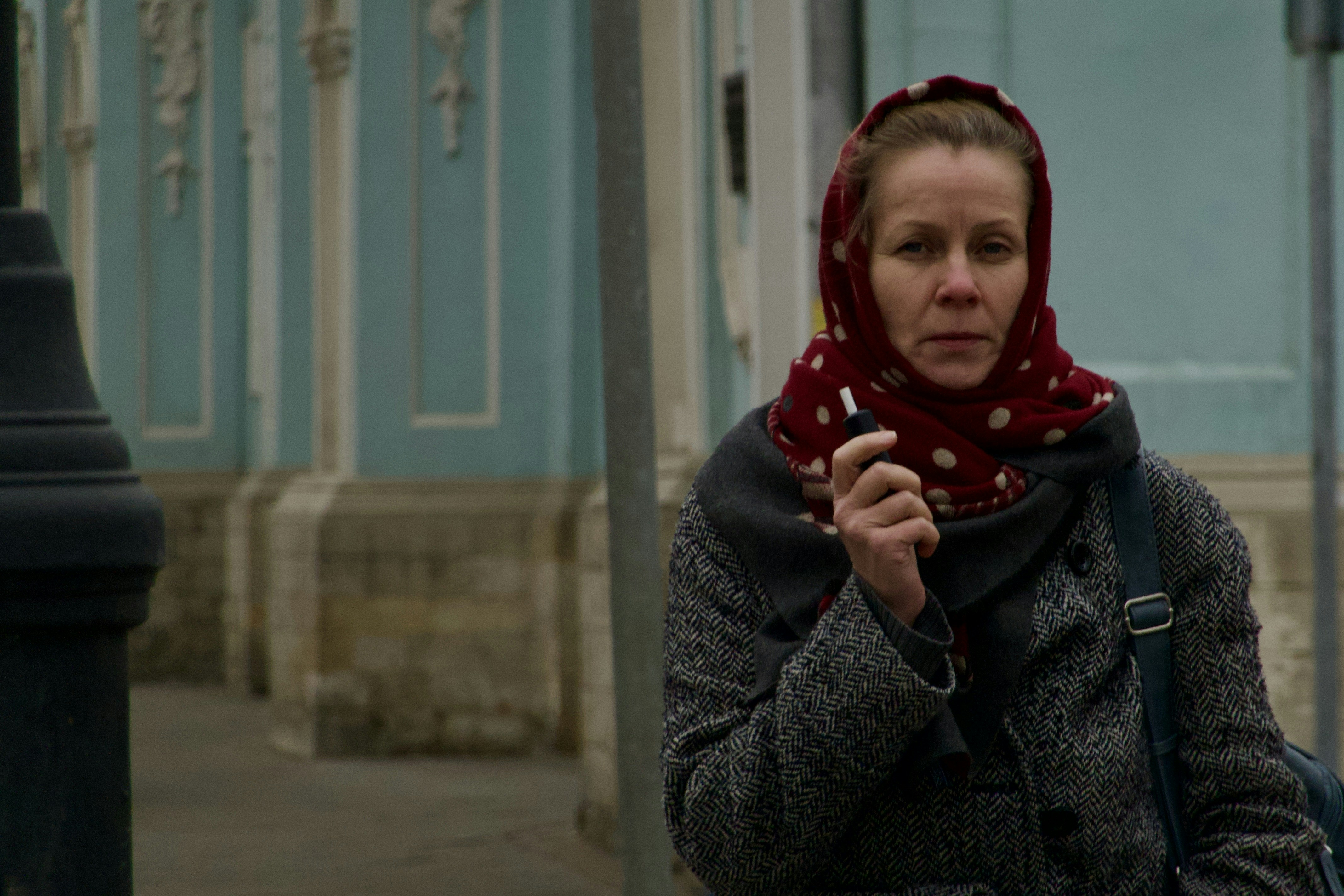 a woman wearing a scarf and a scarf around her head
