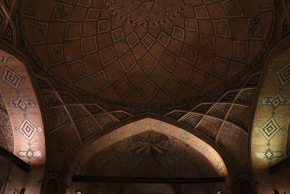 the ceiling of a building with intricate designs