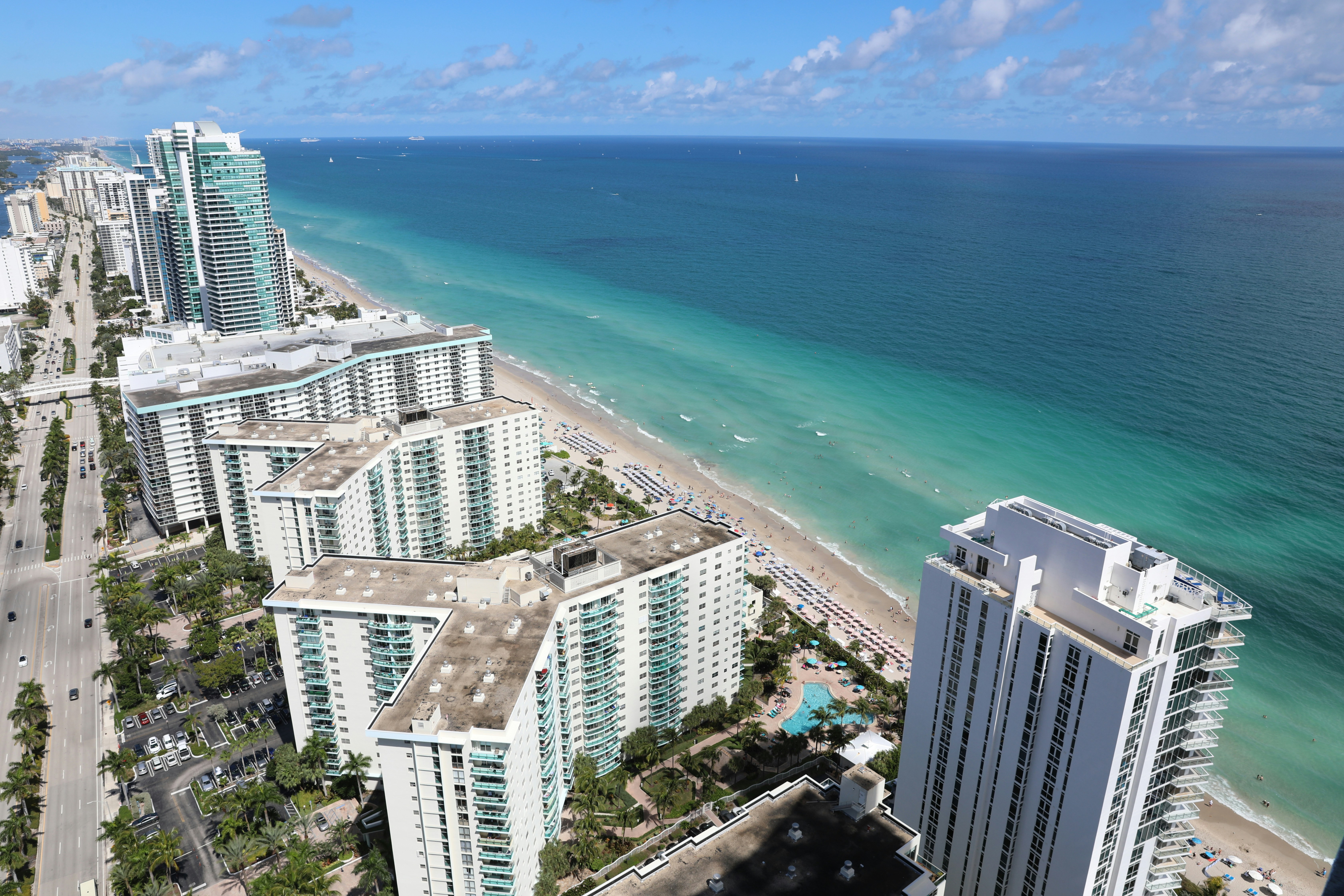 an aerial view of a beach and a city