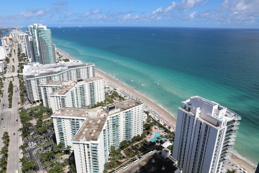 an aerial view of a beach and a city