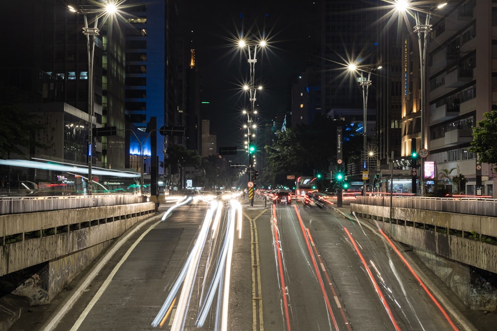 a city street filled with lots of traffic at night