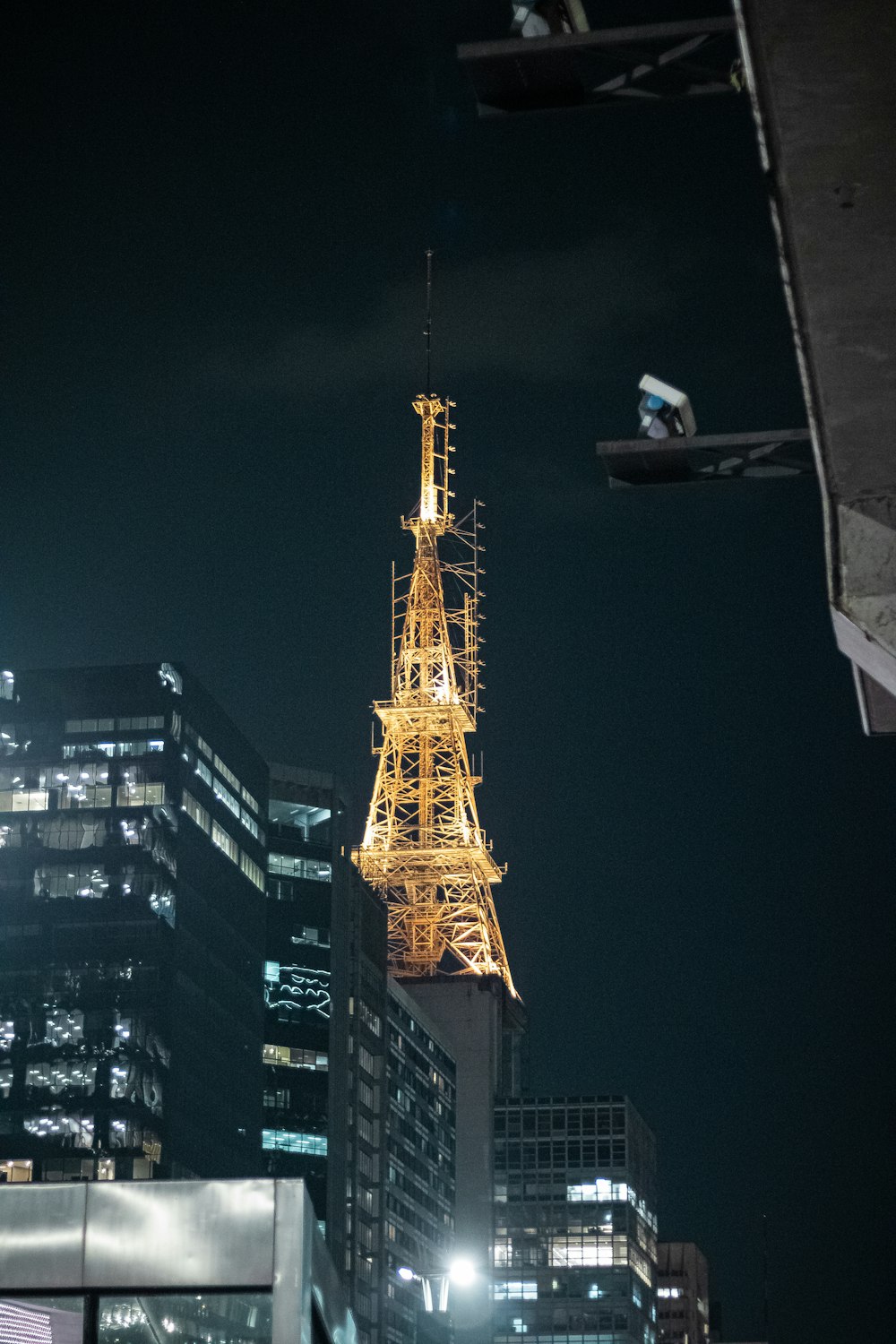 the eiffel tower is lit up at night