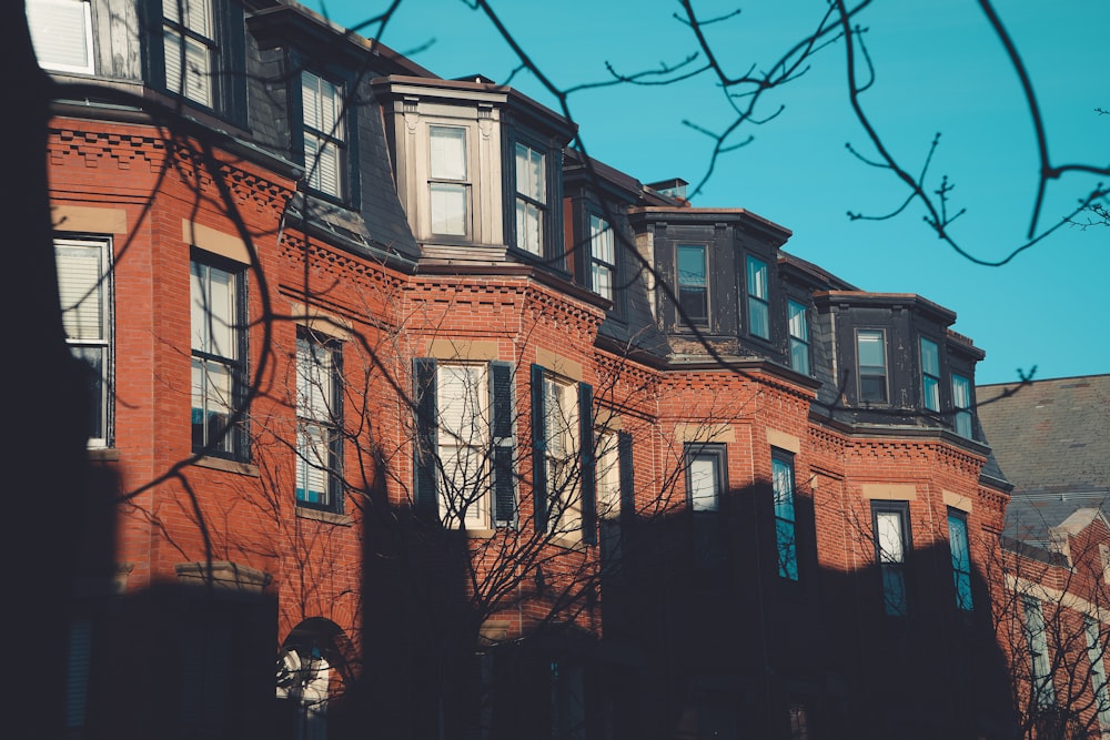 a red brick building with many windows on it