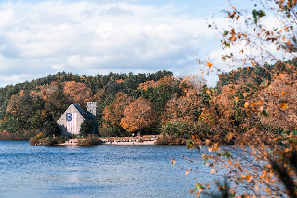 a house on a small island in the middle of a lake