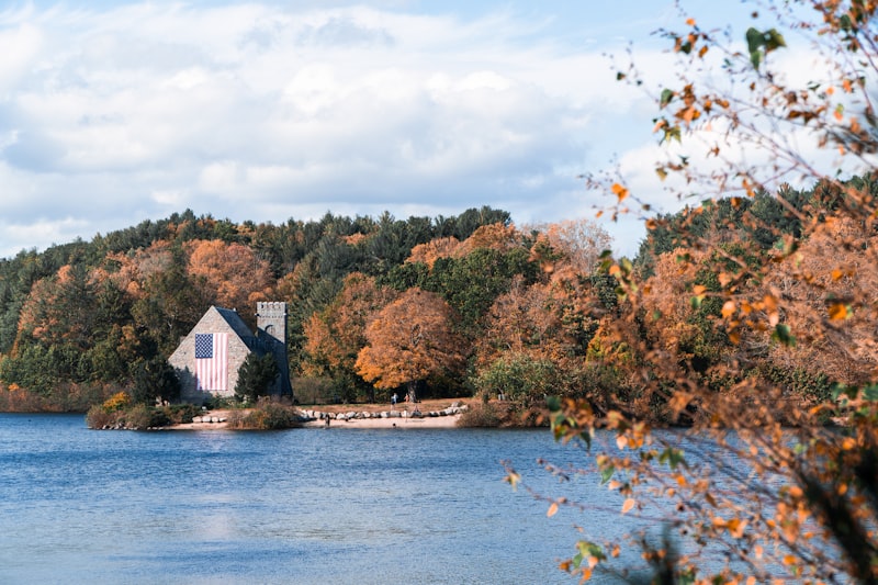 Historic stone church with autumn foliage