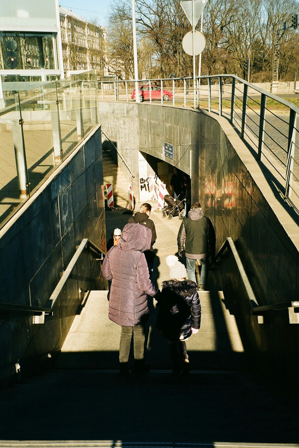 a group of people walking up a flight of stairs