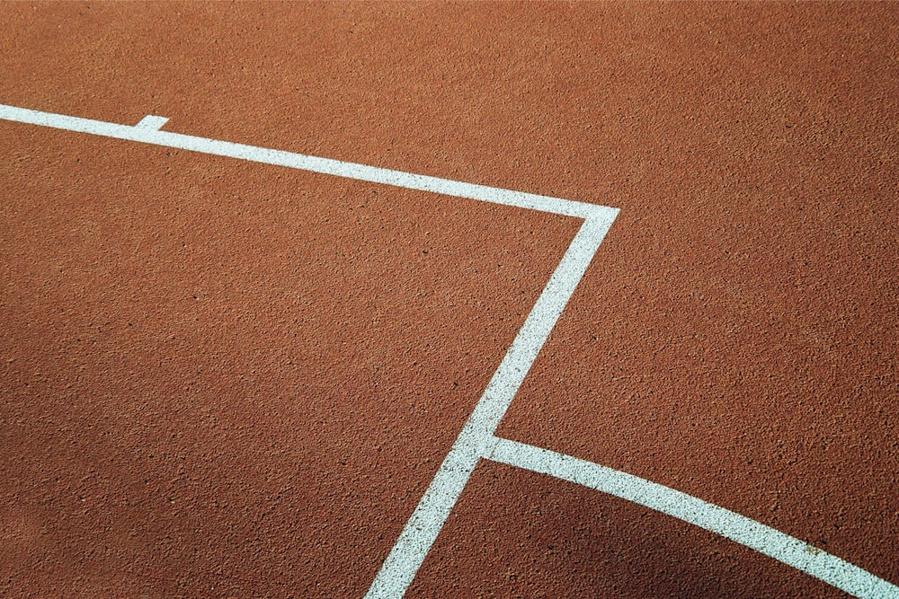 a tennis court with a white line drawn on it