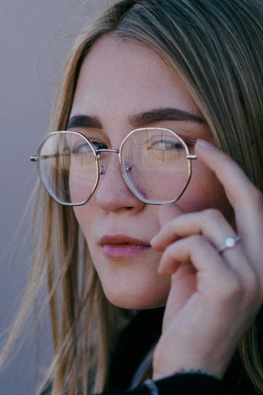 a close up of a person wearing glasses