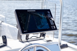 a computer screen on the front of a boat
