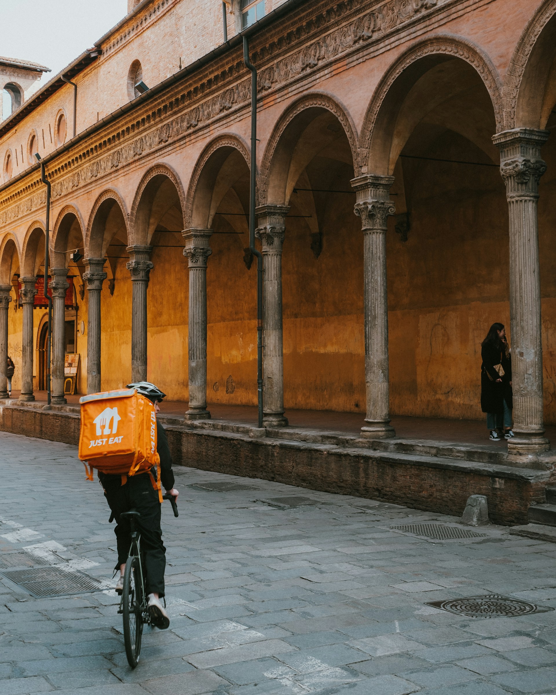 a person riding a bike down a street