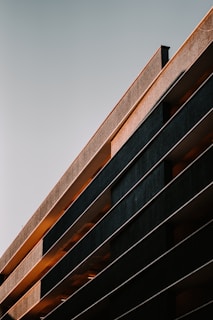 Wide-angle view of a sophisticated mixed-use building featuring clean lines and elegant lighting.