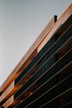 Sunset view of a completed building project with clean lines and modern architecture
