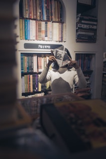 An inspiring image of a woman reading a book in a cozy corner.
