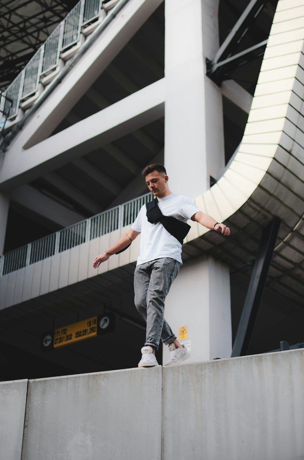 a man riding a skateboard down the side of a cement wall