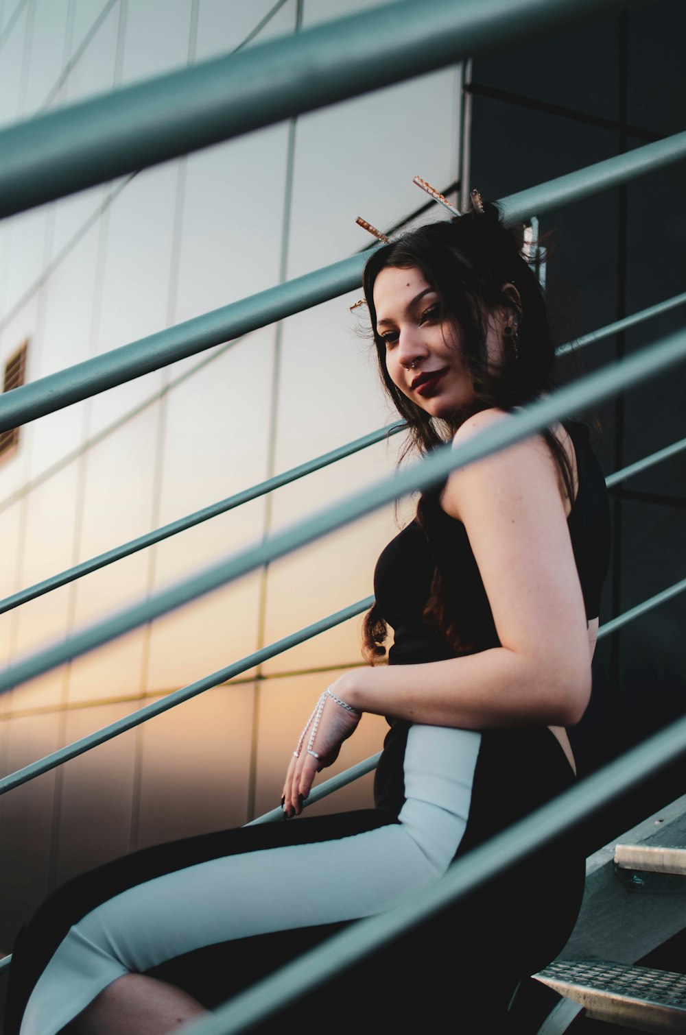 a woman sitting on a set of stairs