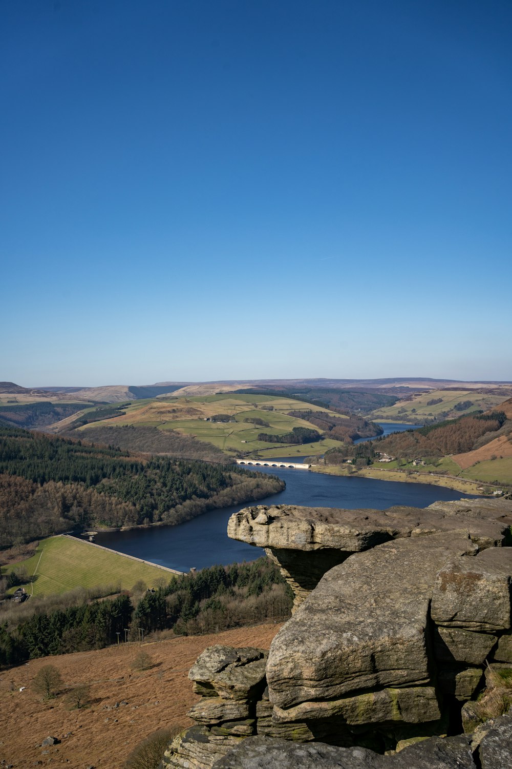 a view of a lake from a high cliff