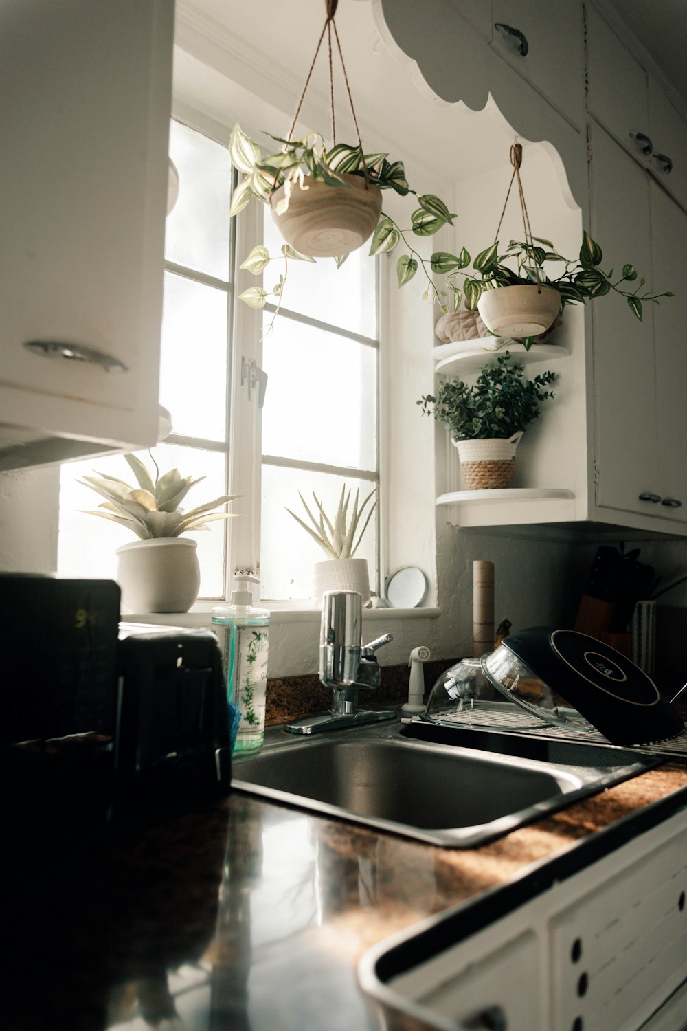 a kitchen with a sink and a window