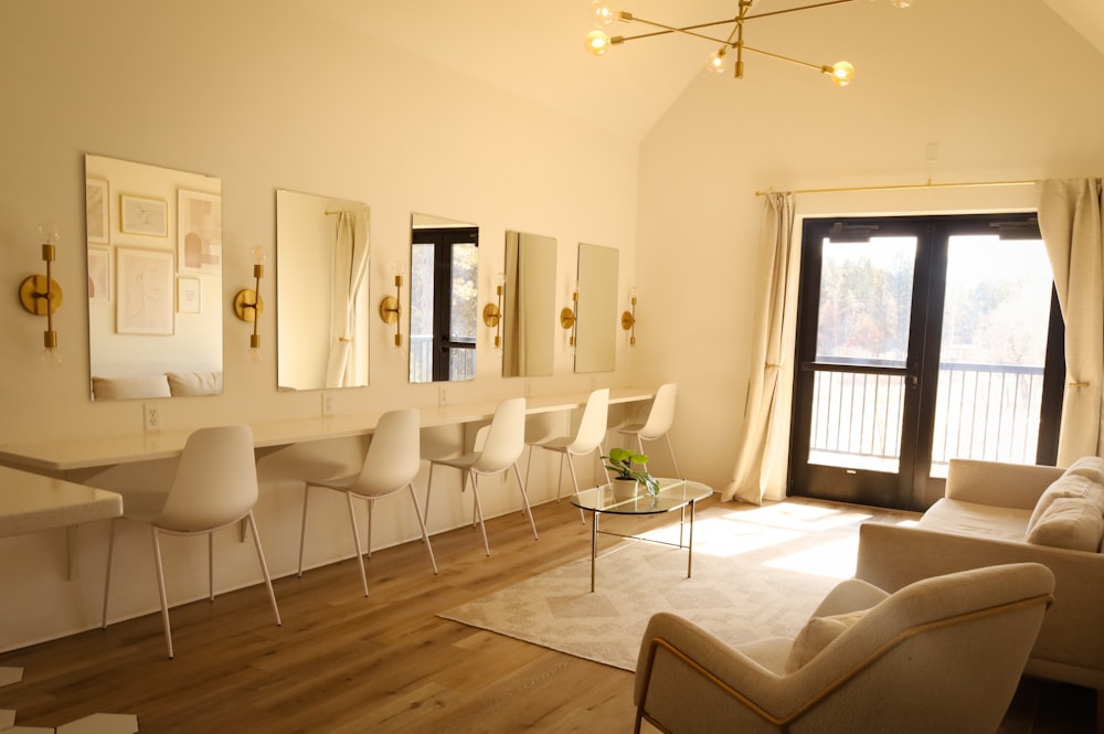 a living room filled with furniture and a large window