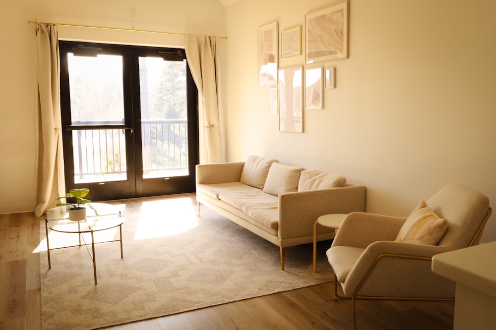 a living room filled with furniture and a window