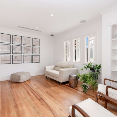 a living room filled with furniture and a flat screen tv