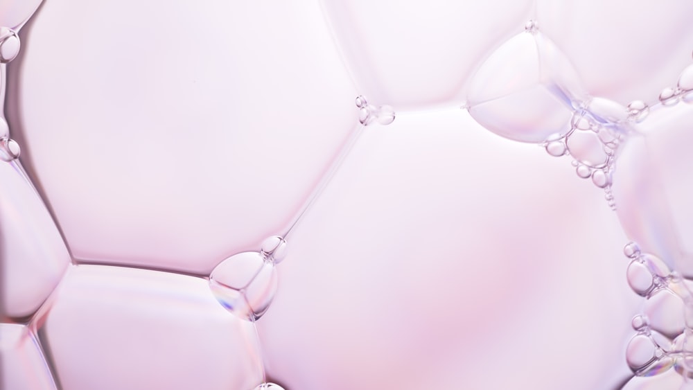 a close up of bubbles on a white surface