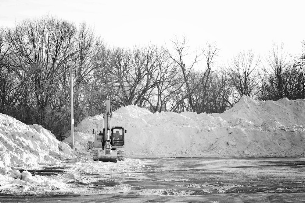 a black and white photo of a snow plow