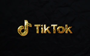A vibrant TikTok logo glowing with purple and gold accents on a dark background.