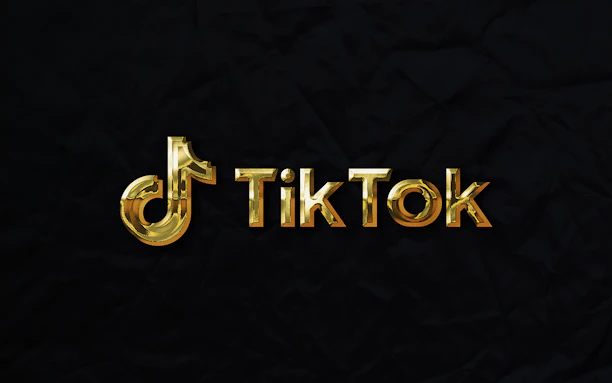 A vibrant TikTok logo with upward trending arrows symbolizing growth.