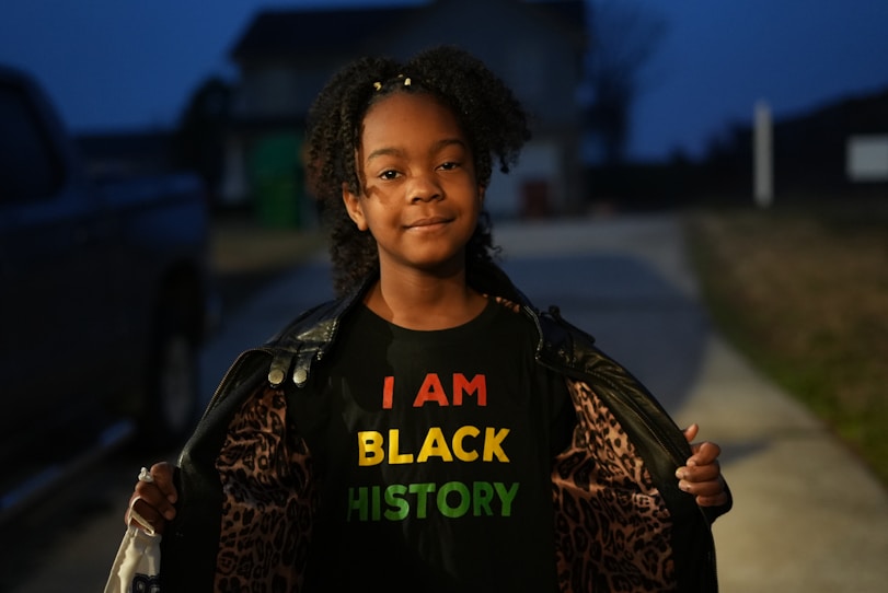 a girl with a t - shirt that says i am black history