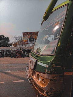 Front view of Sri Lakshitha Travels office with a fleet of diverse vehicles parked outside.