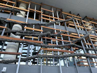 Industrial-style metal framework combined with natural wood panels in a building facade.