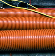 a close up of a bunch of orange hoses