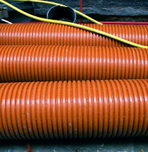 a close up of a bunch of orange hoses