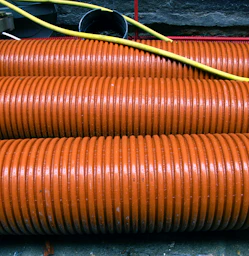 a close up of a bunch of orange hoses