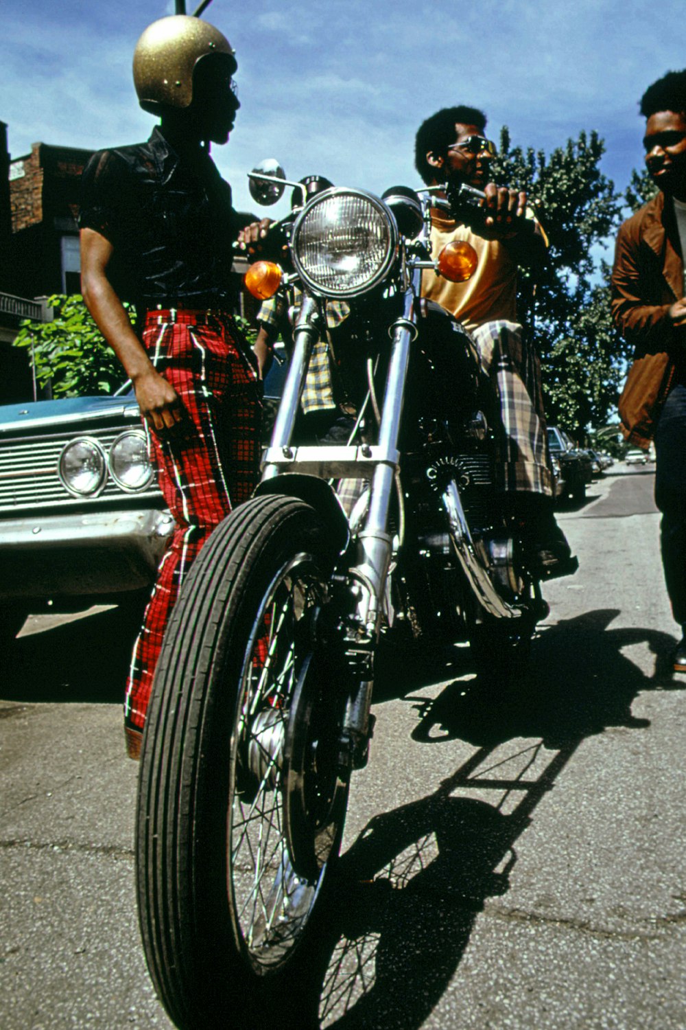 a man riding on the back of a motorcycle