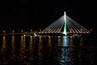 a large bridge over a body of water at night