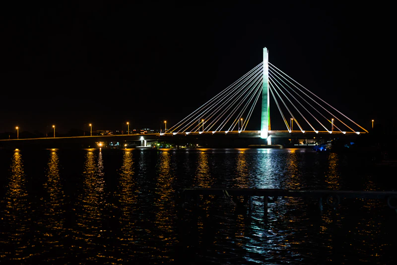 The Lekki Ikoyi Link Bridge lit up over the lagoon at night, Lagos