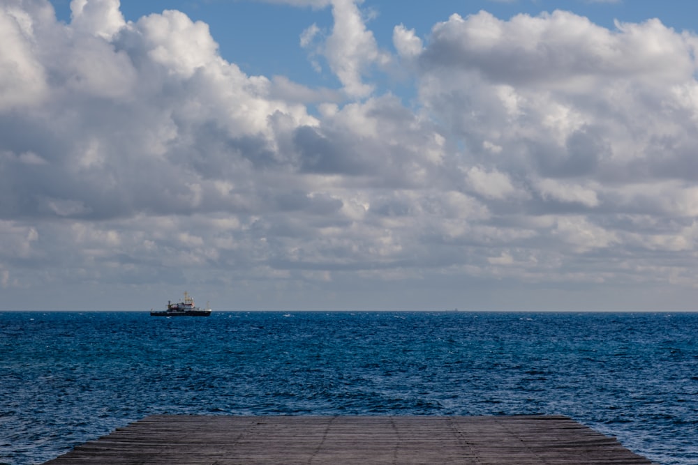 a boat is in the distance on the water