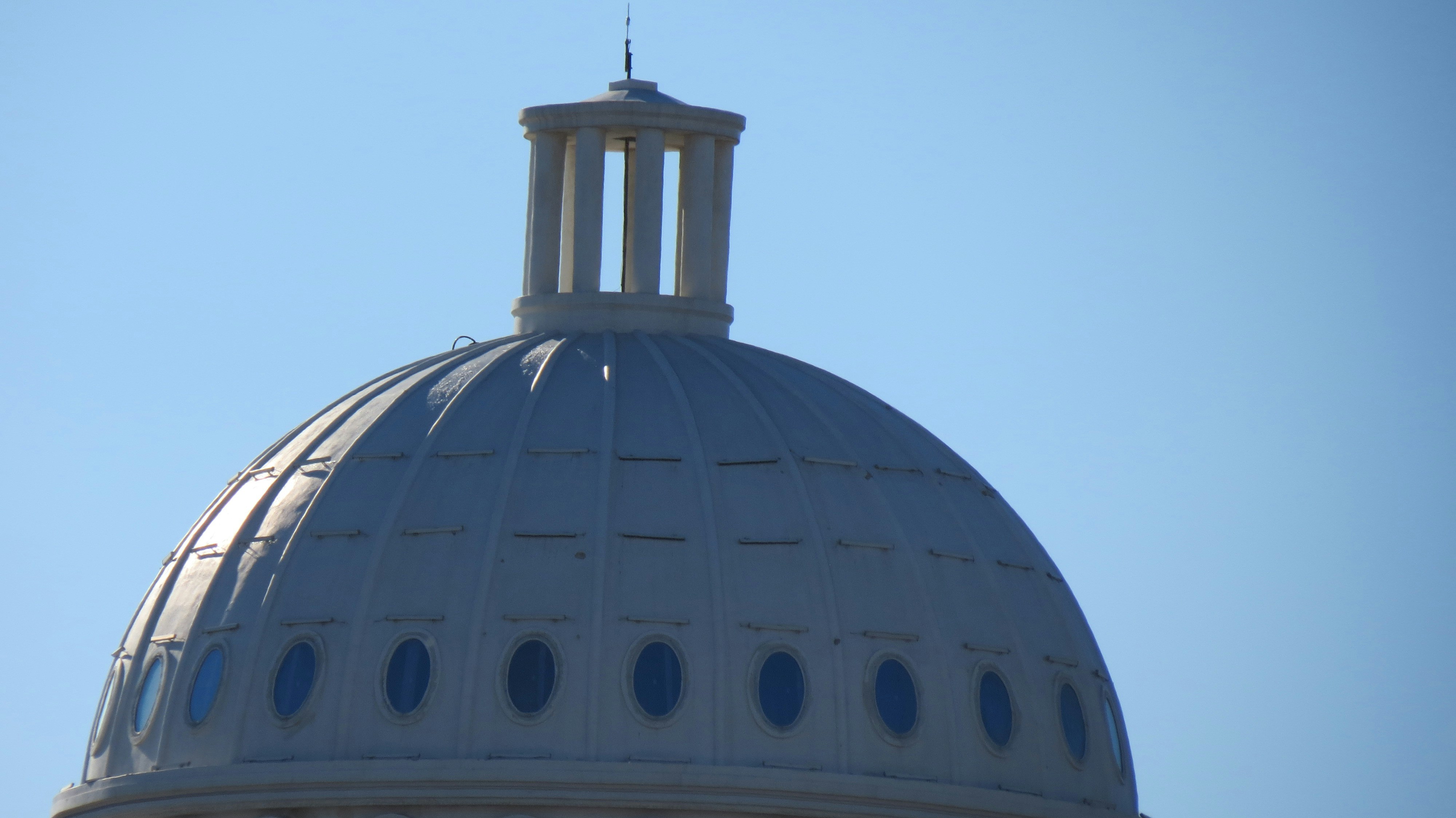 a large dome with a clock on top of it