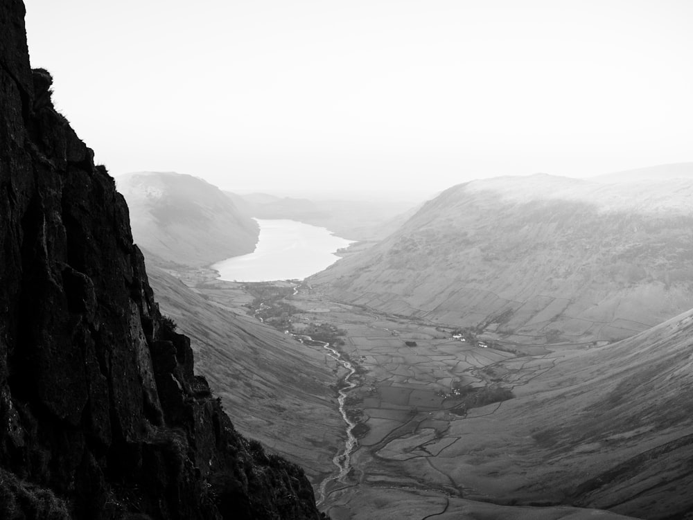 a black and white photo of a valley