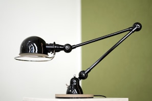 A smart eye-care desk lamp with adjustable brightness on a tidy study desk