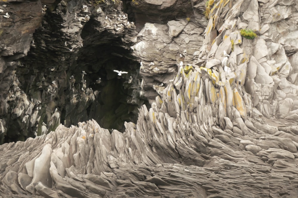 a large rock formation with a cave in the middle of it