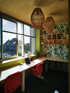 A stylish home office corner with a Viper Ventures desk and ergonomic chair, bathed in natural light.