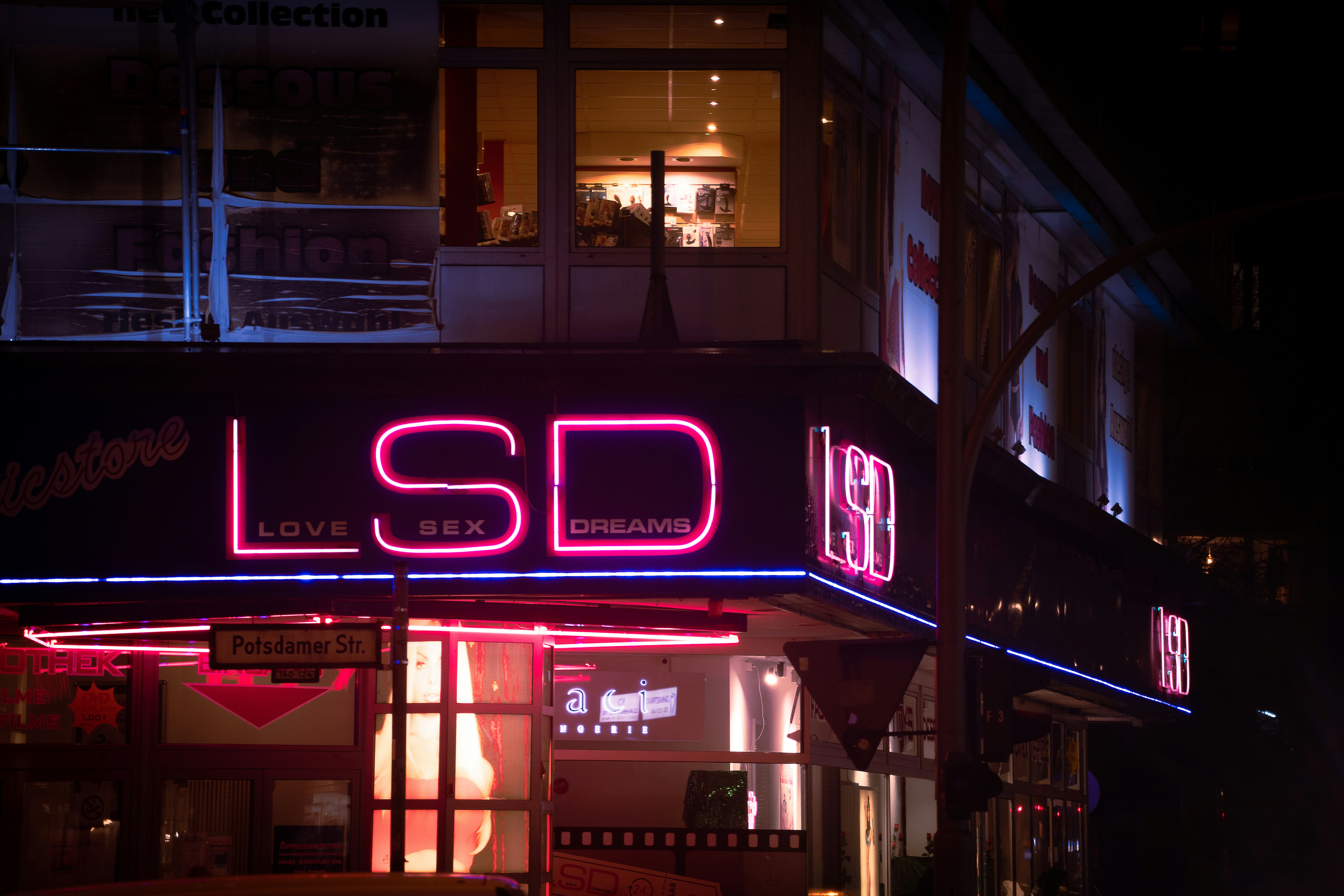 a building that has a neon sign on it