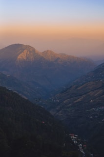 Sunset view over the Chupani Vista bungalows with mountains in the background.
