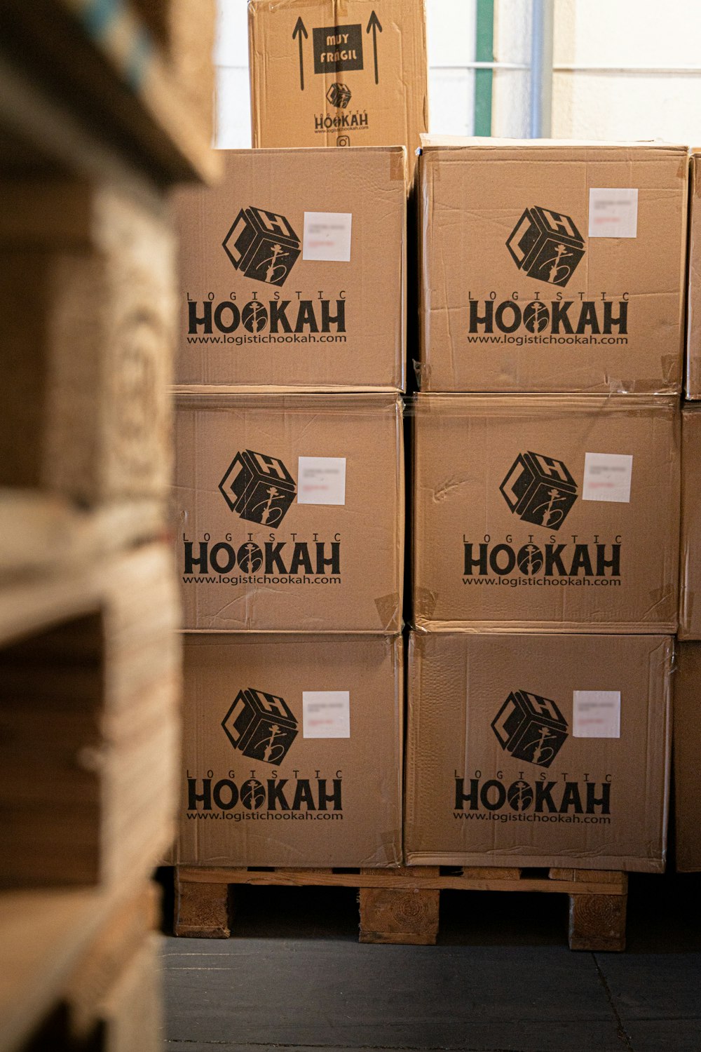 a stack of boxes sitting on top of a wooden pallet