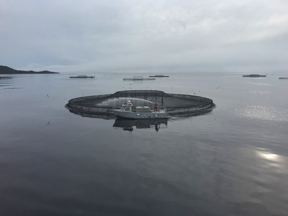 a boat floating on top of a large body of water